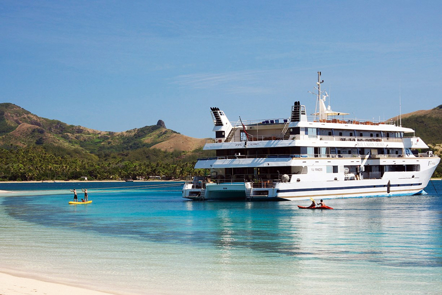 The ship moors up at stunning Nanuya Lailai island