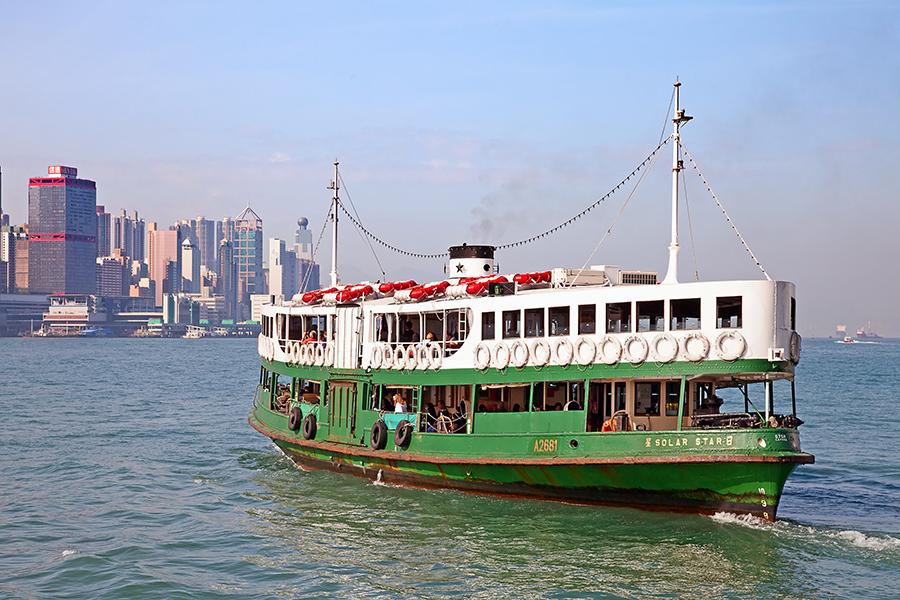 The iconic Star ferry crossing Victoria Harbour, Hong Kong